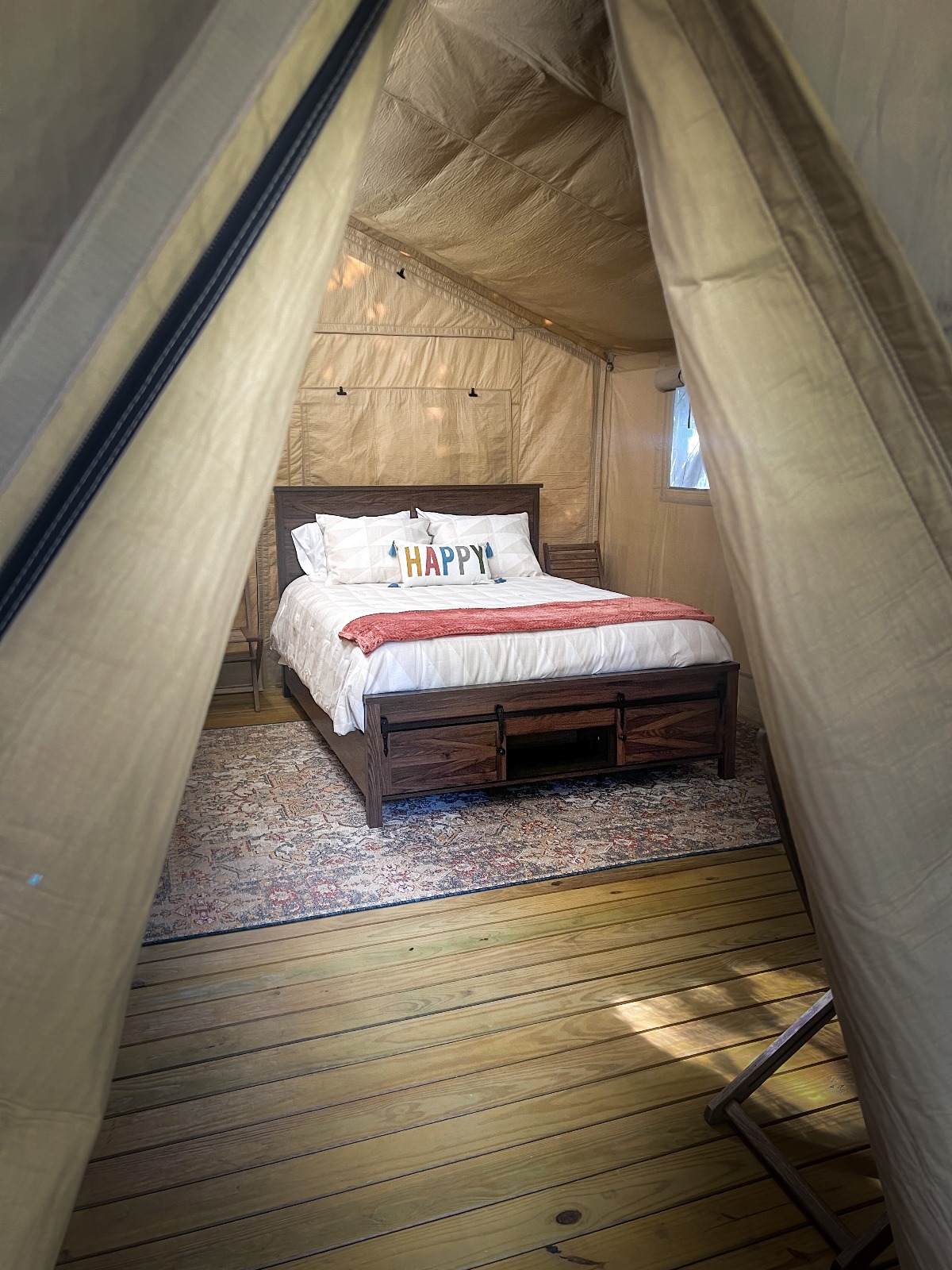 Close up of luxury glamping tent bed.